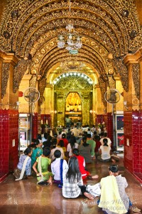 Praying to the Mahamuni Buddha